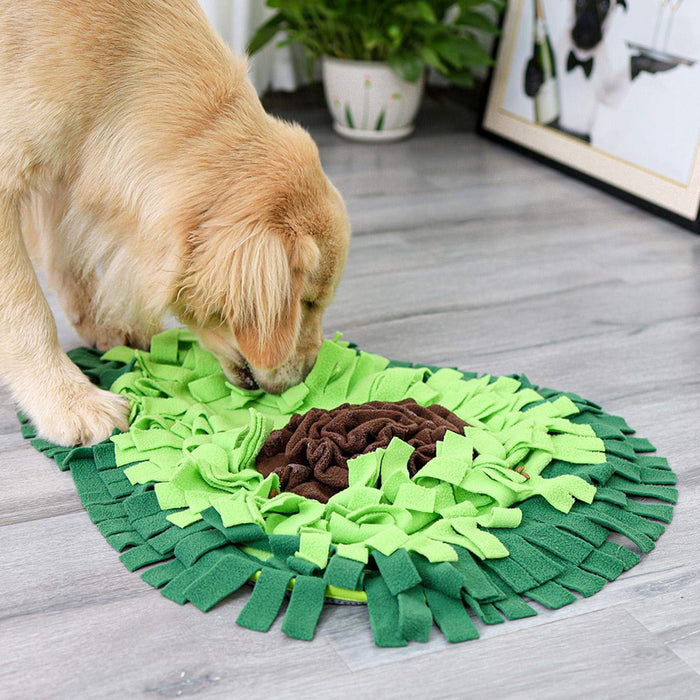 Dog sniffing out kibble in The Snuffle Mat